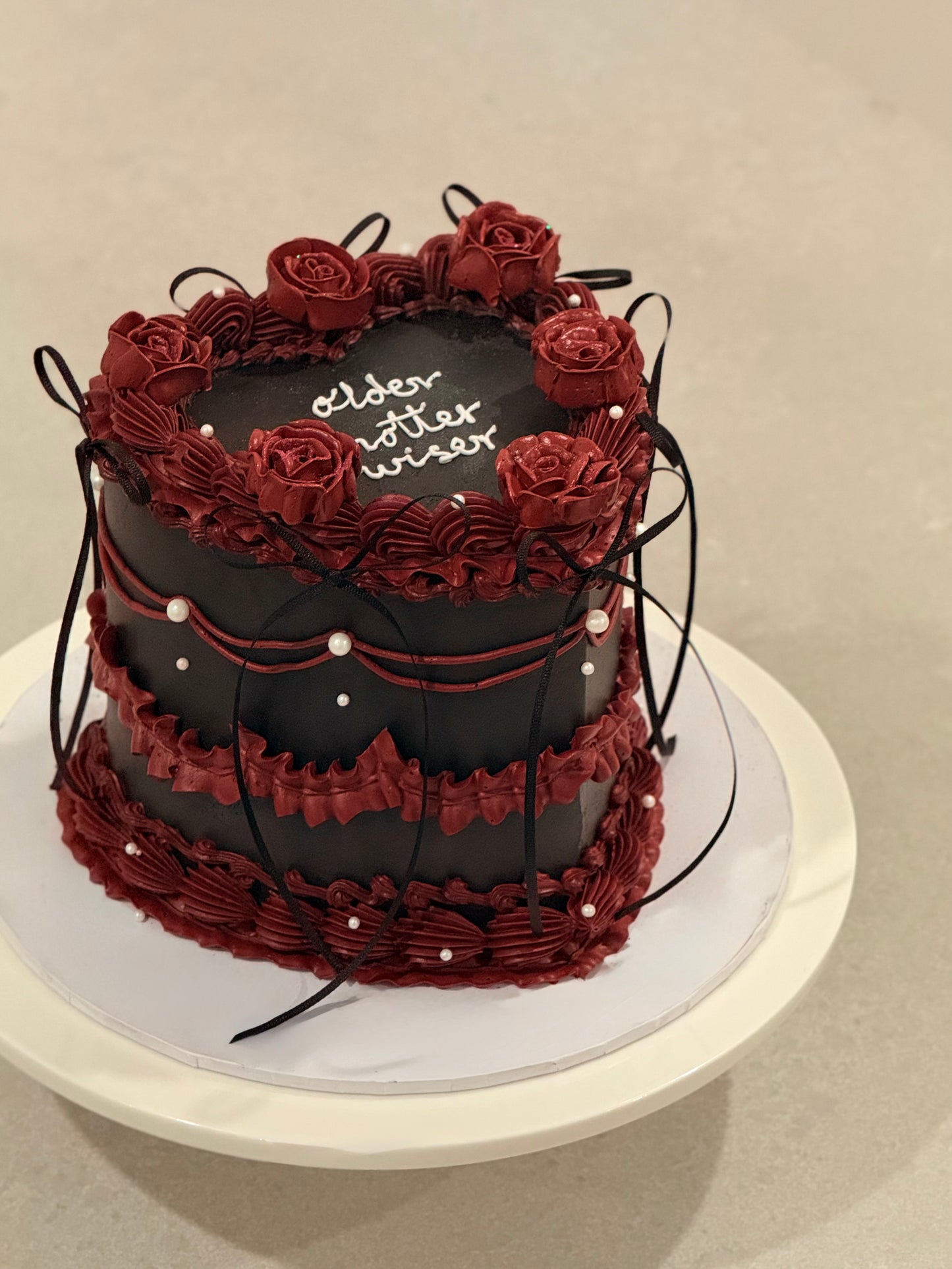 Colette moody black and burgundy celebration cake — custom cake Melbourne by Bakeology Studios
