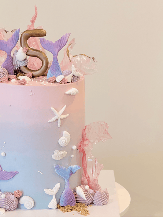 Mariana under-the-sea cake side view with shimmering pearl and shell detail — Bakeology Studios Melbourne