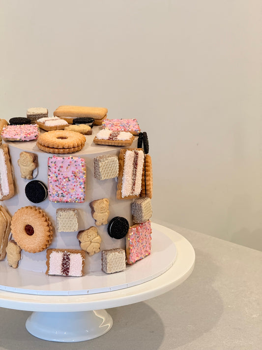 Betty's Biscuit Tin open to show the handcrafted biscuit assortment — Bakeology Studios Melbourne