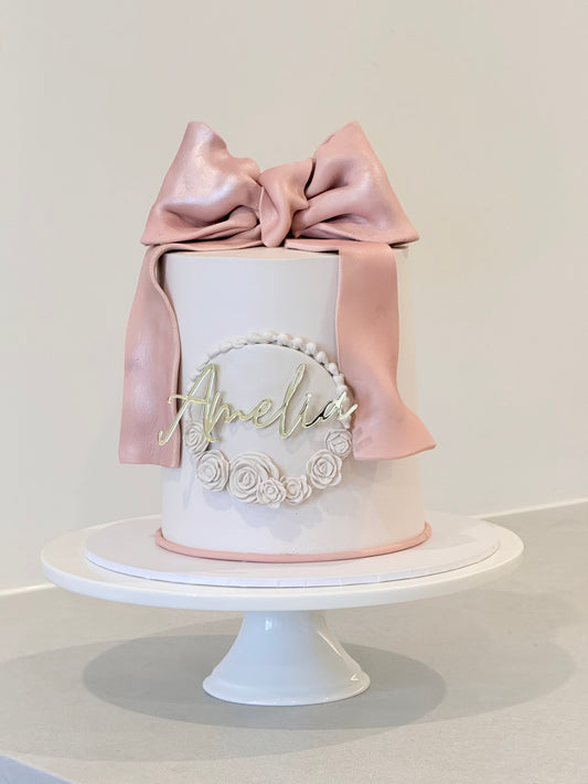 Amelia romantic blush cake side view with soft floral detail — handcrafted by Bakeology Studios Melbourne