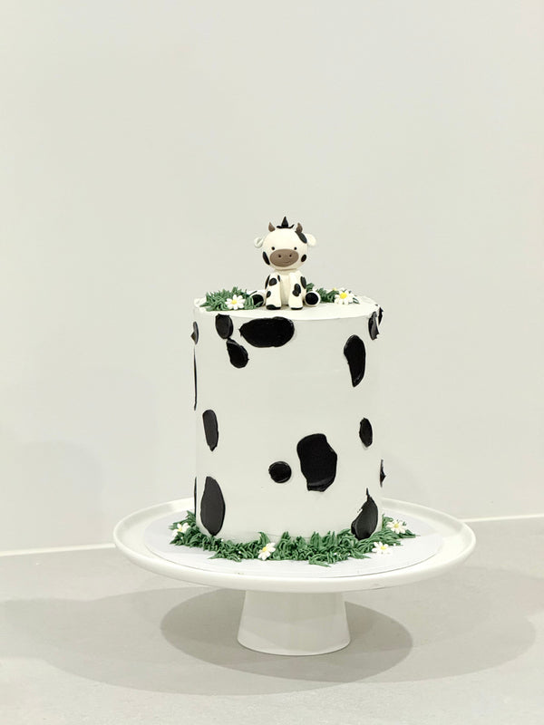 Millie cow print kids birthday cake with sculpted topper — custom cakes delivered to Glen Waverley, Bakeology Studios