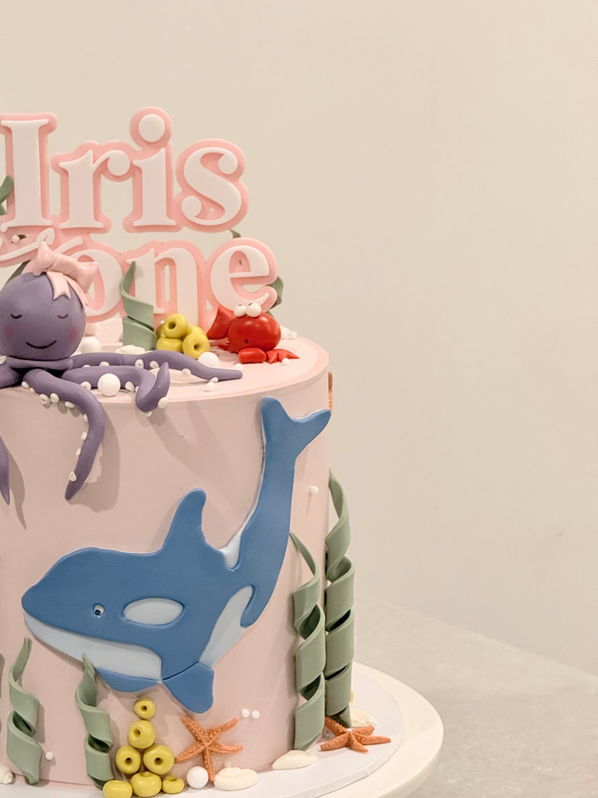 Iris under-the-sea cake with sculpted whale and octopus figurines — Bakeology Studios Melbourne