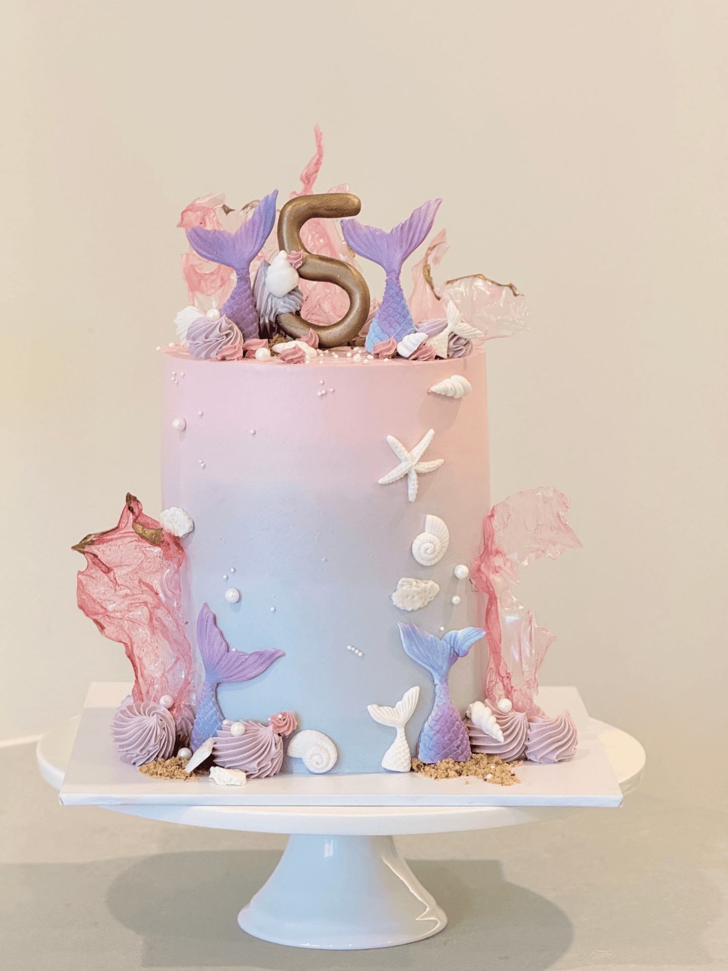 Mariana coastal celebration cake in dreamy pastels with pearls and ocean treasures — Bakeology Studios Melbourne