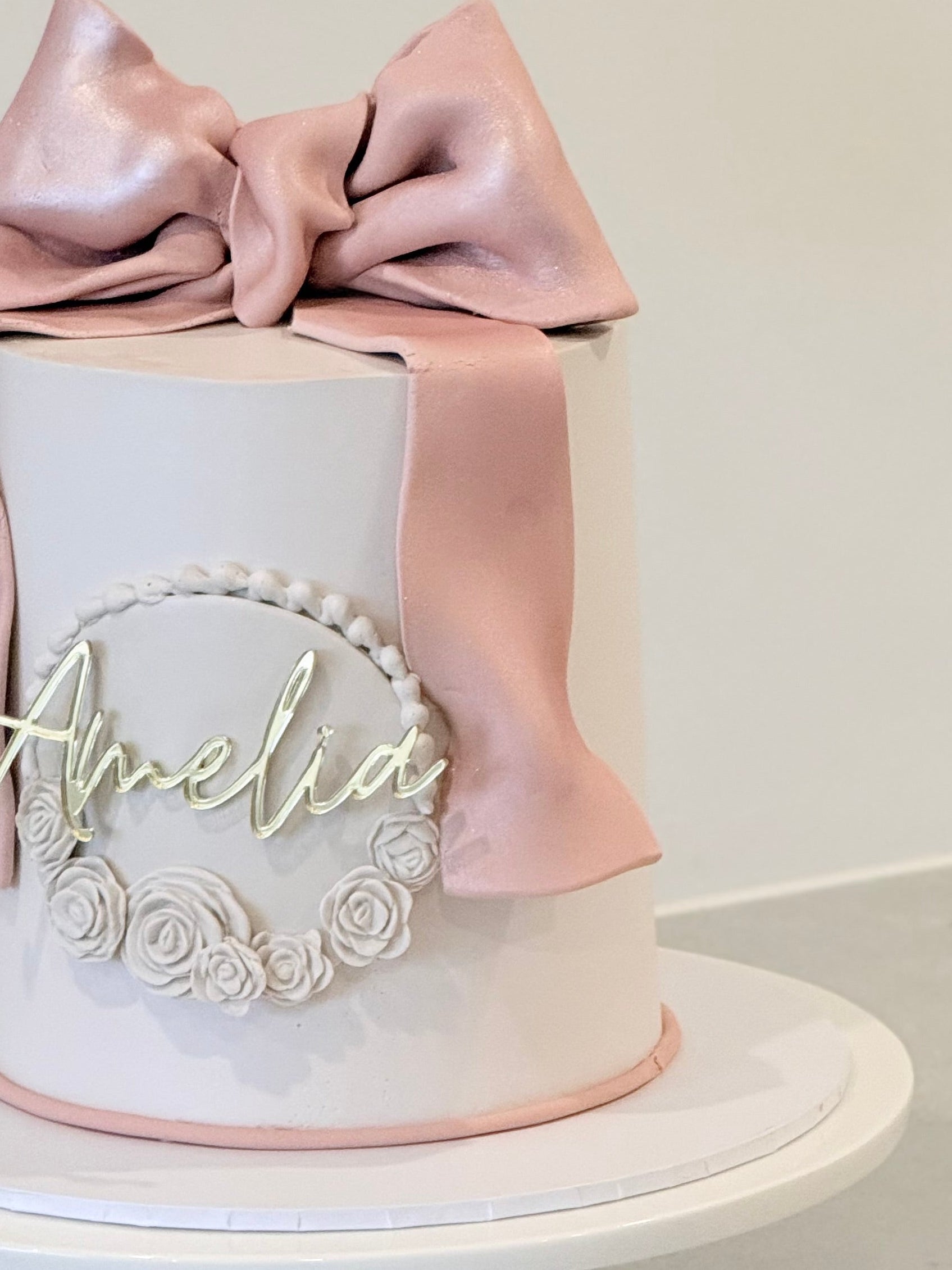 Amelia close-up detail — blush satin ribbon and piped florals, handcrafted in Burwood East Melbourne