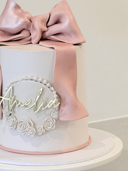 Amelia close-up detail — blush satin ribbon and piped florals, handcrafted in Burwood East Melbourne