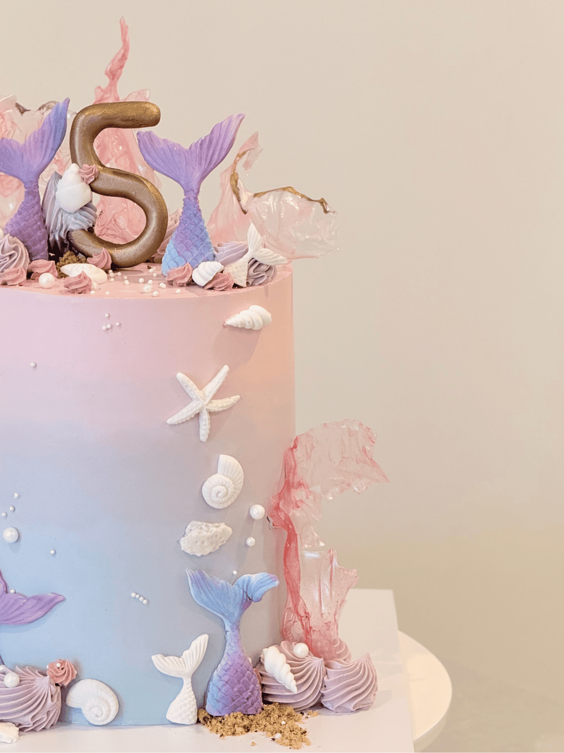 Mariana under-the-sea cake side view with shimmering pearl and shell detail — Bakeology Studios Melbourne