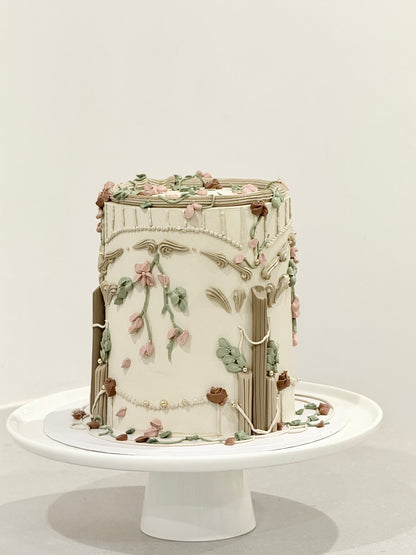 Cleo side detail — hand-piped florals and sage leaves on vintage celebration cake Melbourne Bakeology Studios