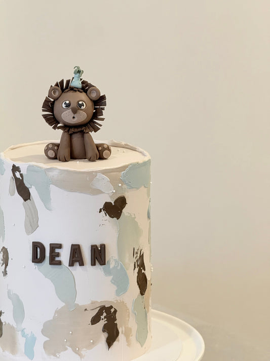 Dean kids birthday cake with sculpted lion and watercolour texture — Bakeology Studios Melbourne