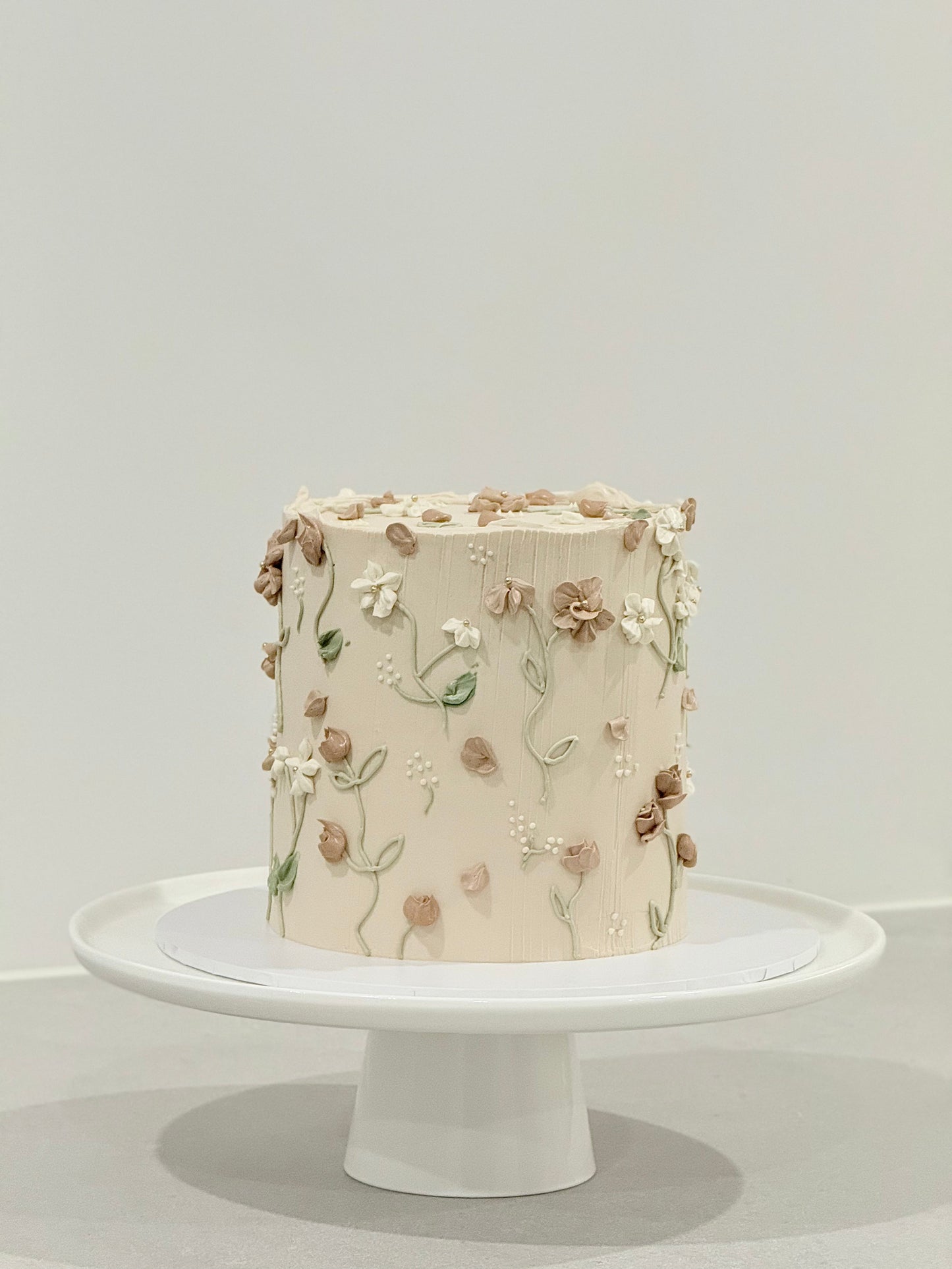Elodie 3D sculpted floral buttercream cake in warm parchment tones — Bakeology Studios Melbourne
