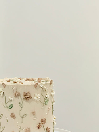 Elodie organic 3D floral celebration cake in warm linen tones — handcrafted Melbourne Bakeology Studios