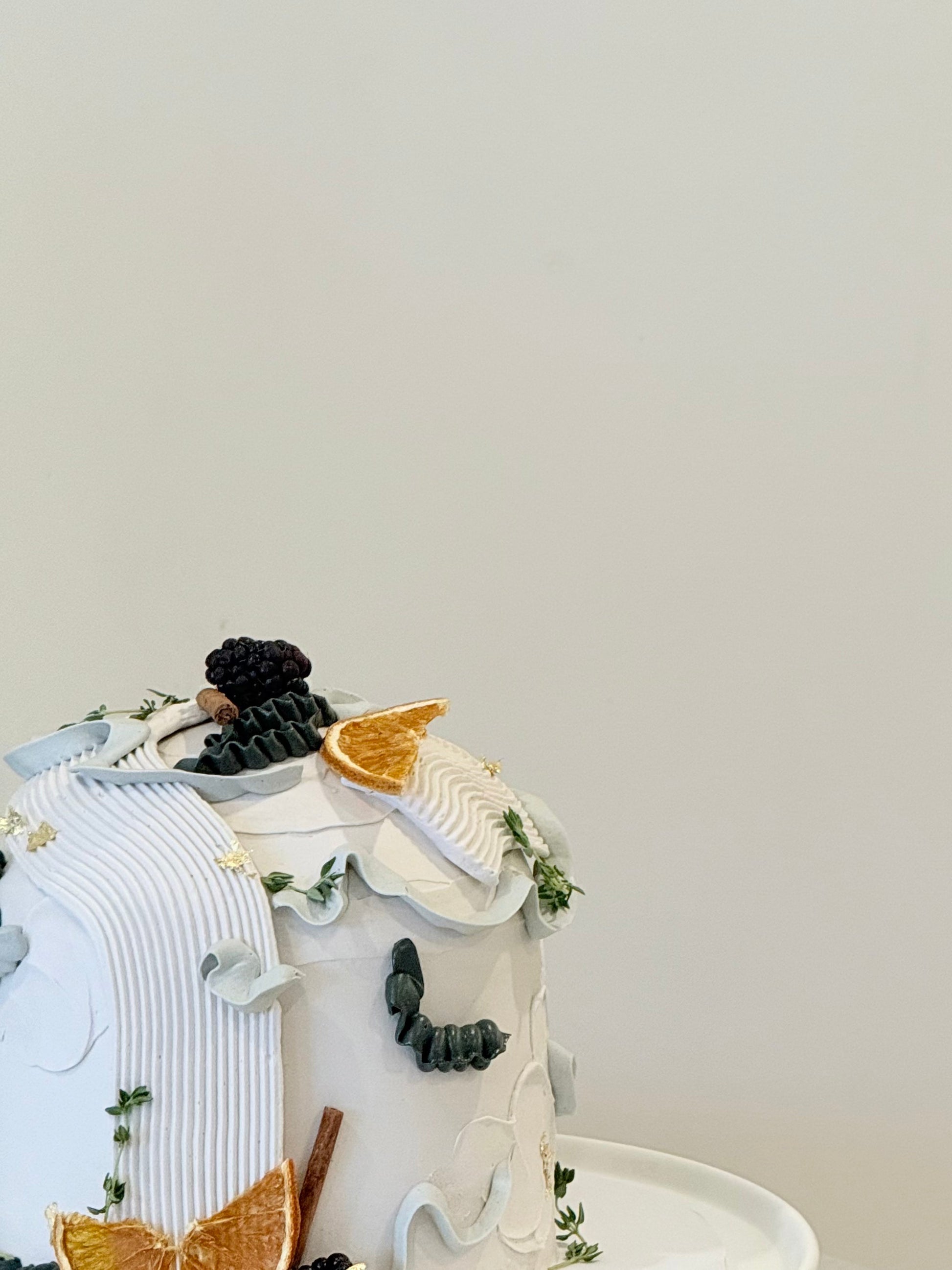 Elowen editorial luxury celebration cake with dried fruit and botanical styling — handcrafted by Bakeology Studios Melbourne