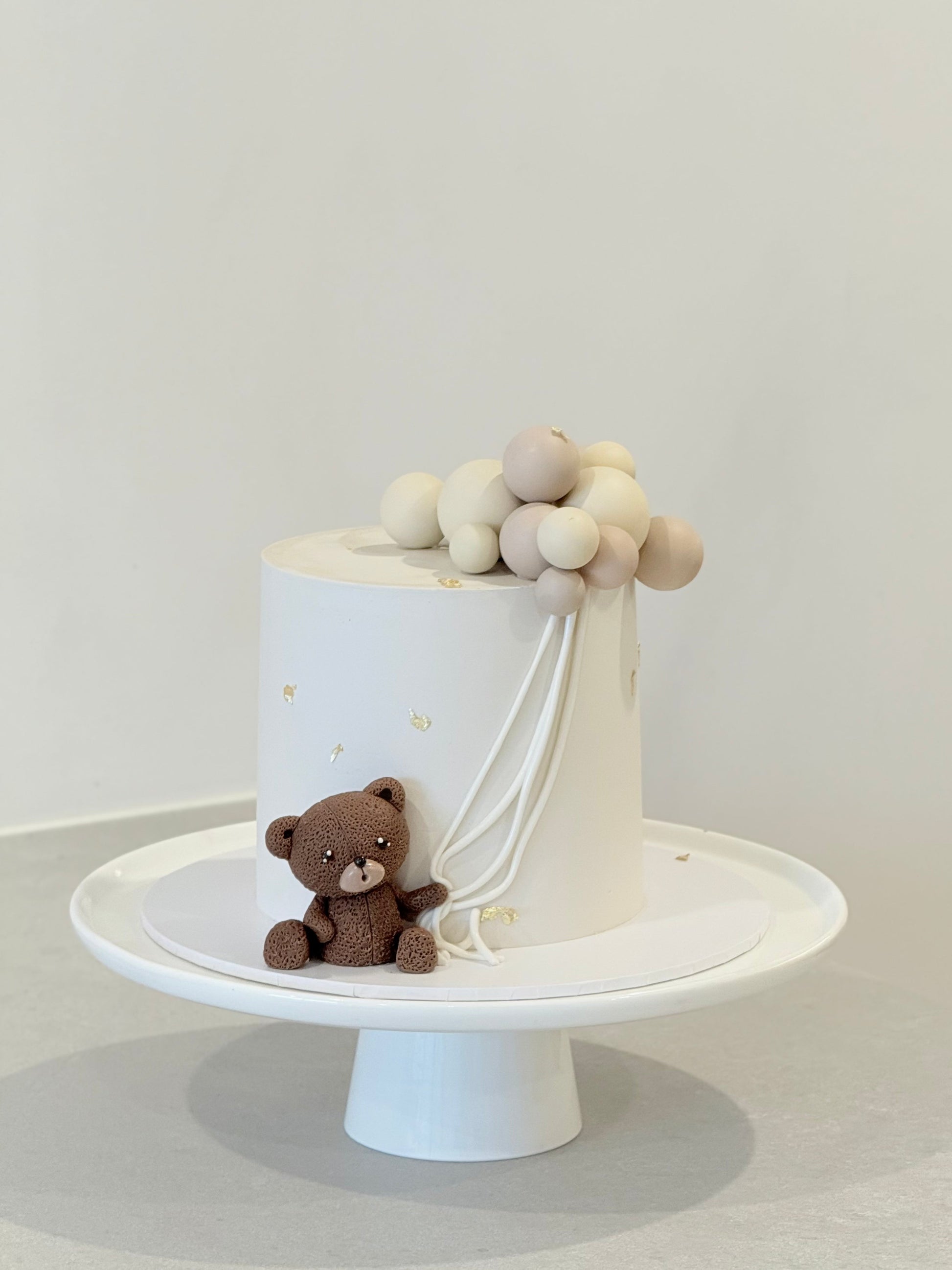 Finn teddy bear balloon kids birthday cake — cream buttercream with sculpted bear figurine Melbourne Bakeology Studios