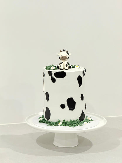 Millie cow print kids birthday cake with sculpted cow topper — Bakeology Studios Melbourne