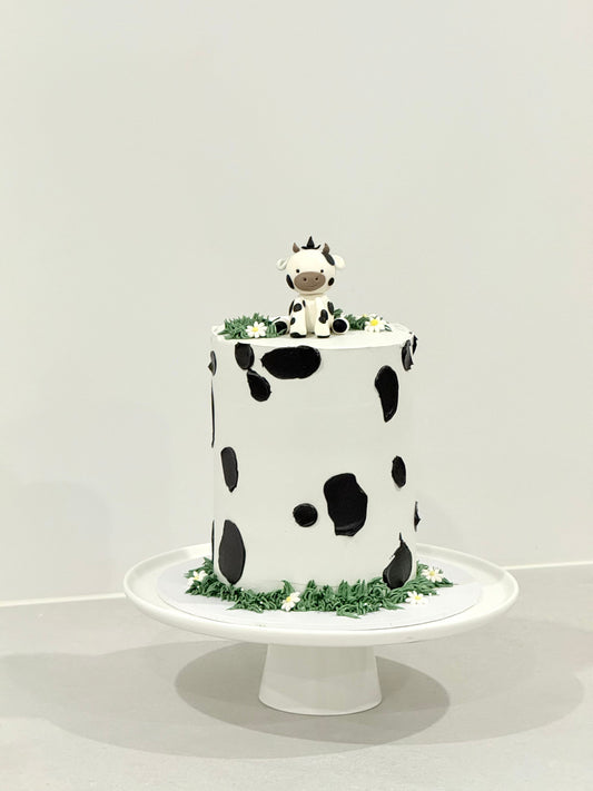 Millie cow print kids birthday cake with sculpted cow topper — Bakeology Studios Melbourne
