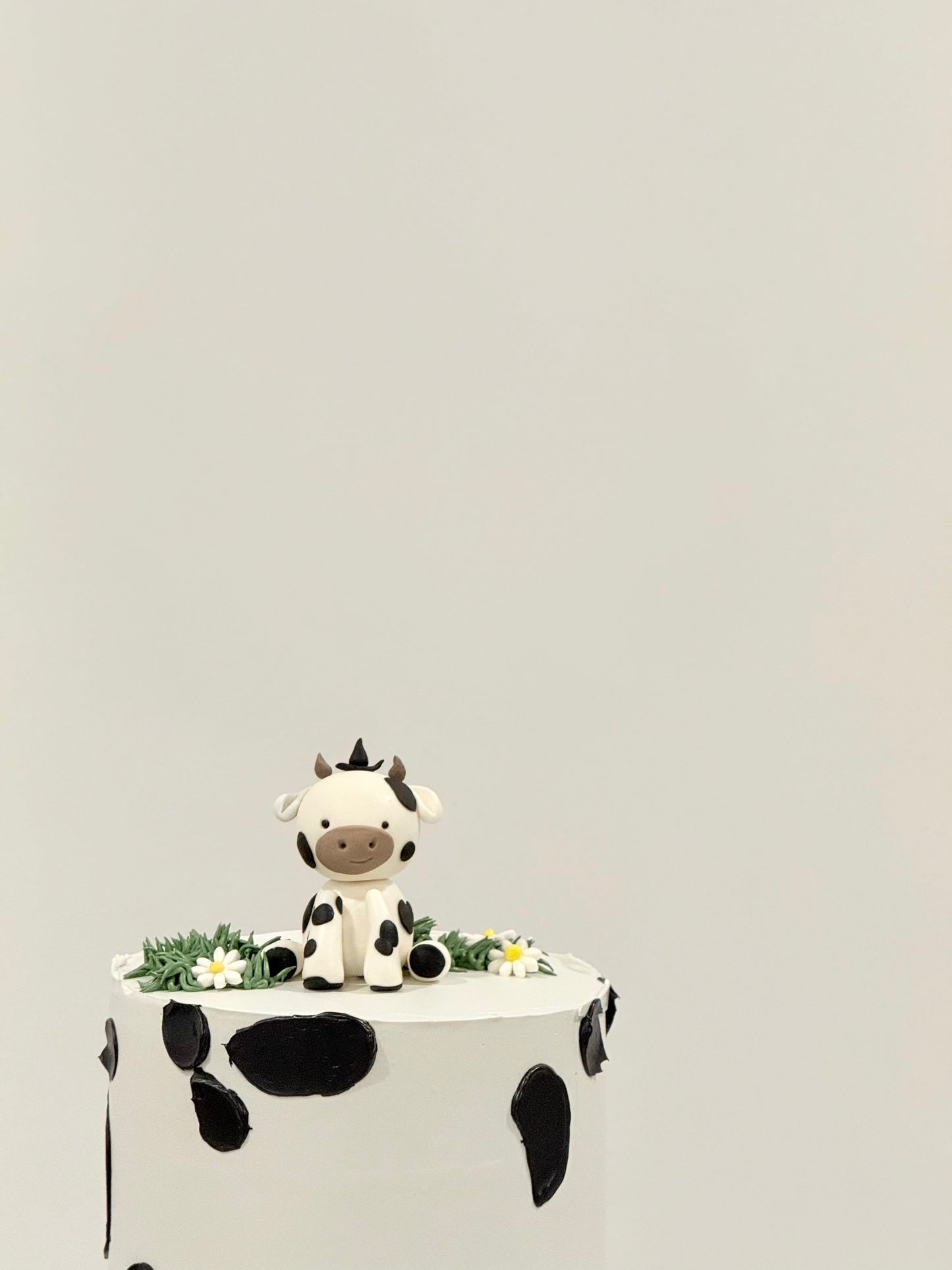 Millie handcrafted cow themed kids celebration cake — custom birthday cake Melbourne by Bakeology Studios