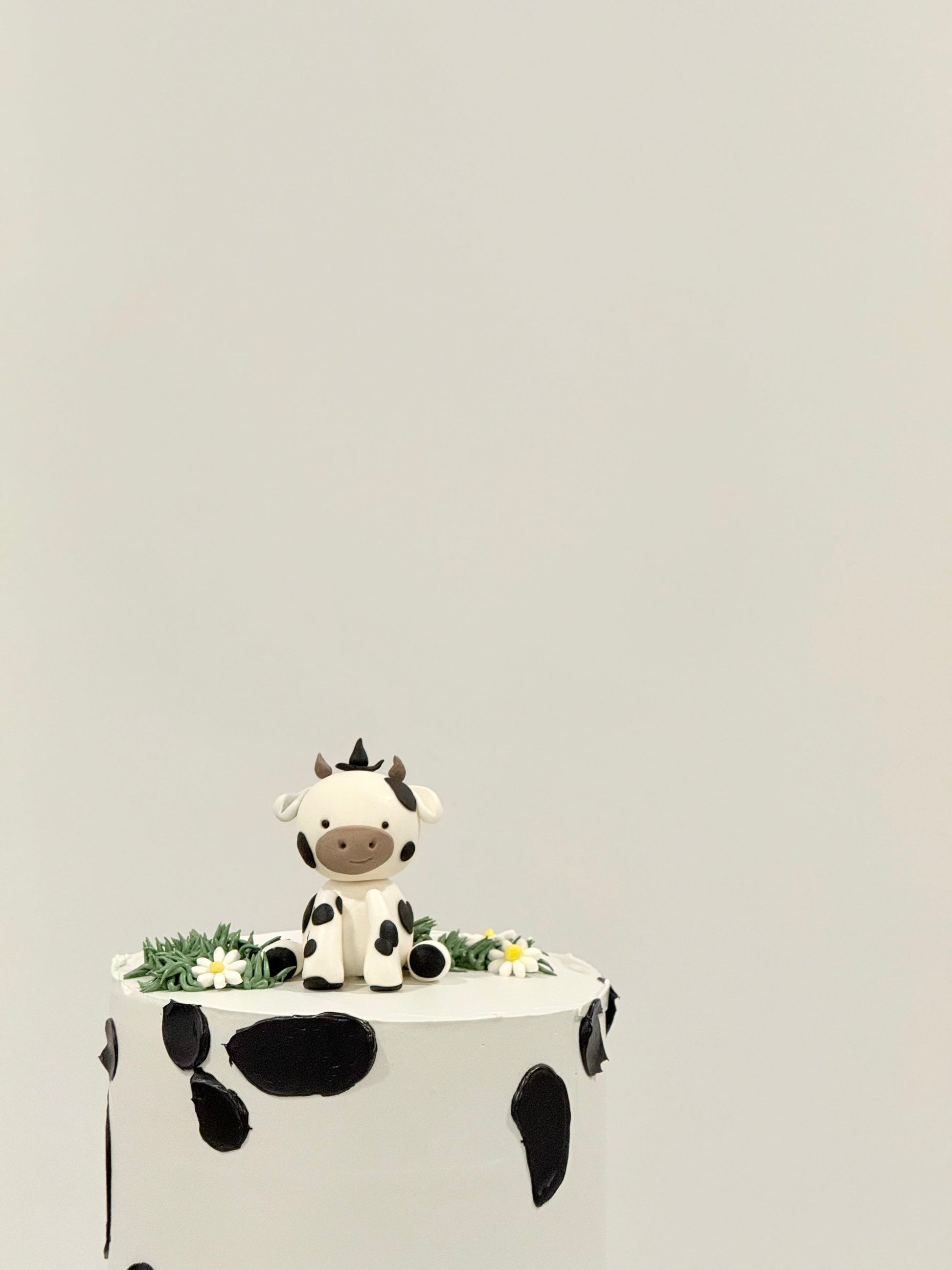 Millie handcrafted cow themed kids celebration cake — custom birthday cake Melbourne by Bakeology Studios