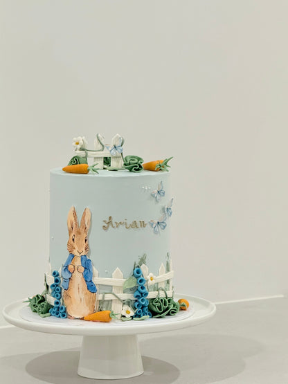 Peter Rabbit birthday cake top view — carrots butterflies and garden details — Bakeology Studios Melbourne