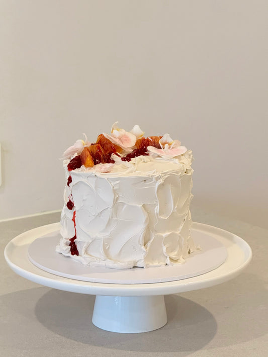 Rustic textured white buttercream cake with fresh florals and berry drizzle — Bakeology Studios Melbourne