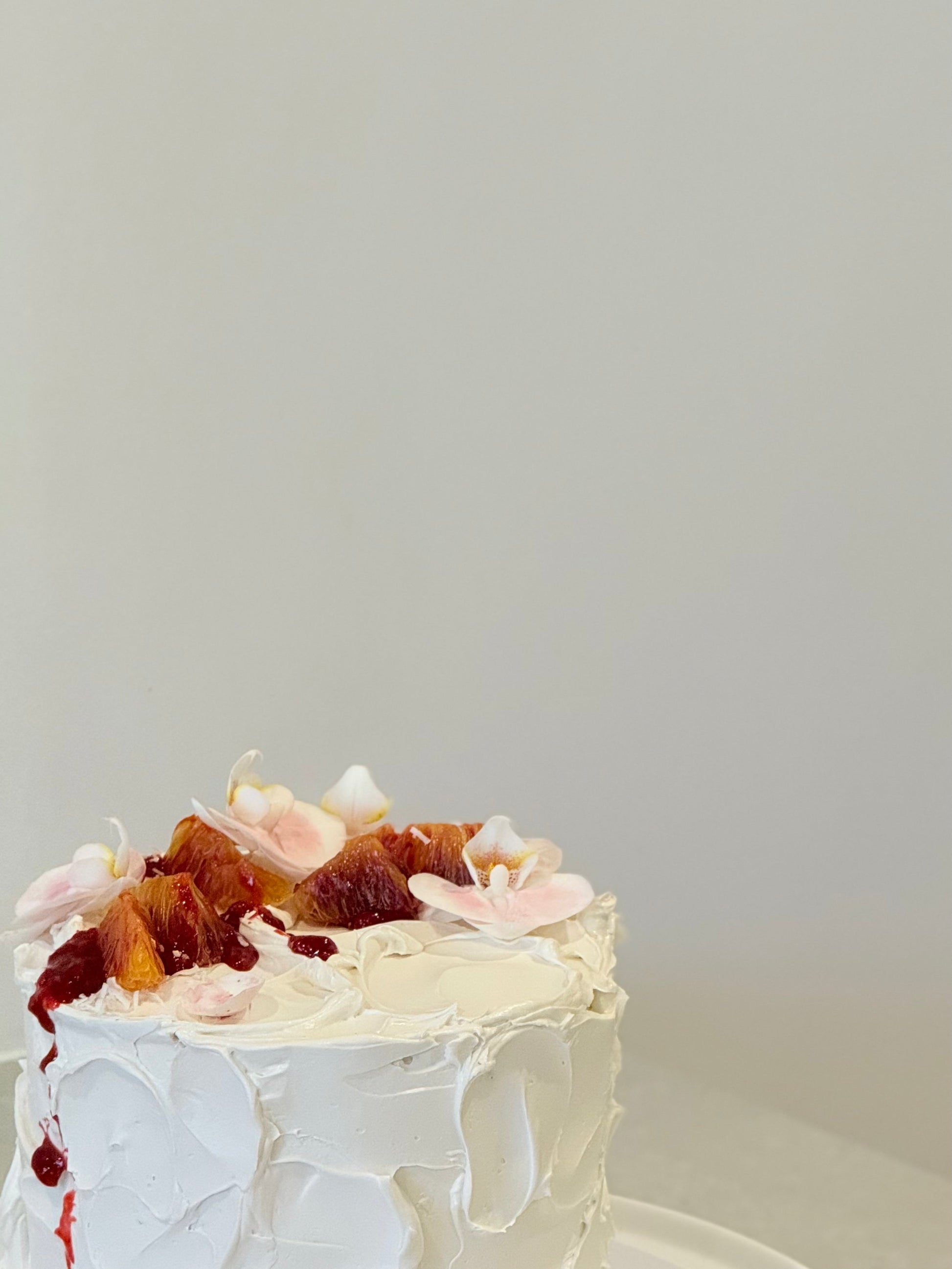 Close-up detail of rustic floral birthday cake with organic buttercream swirls — Bakeology Studios Melbourne