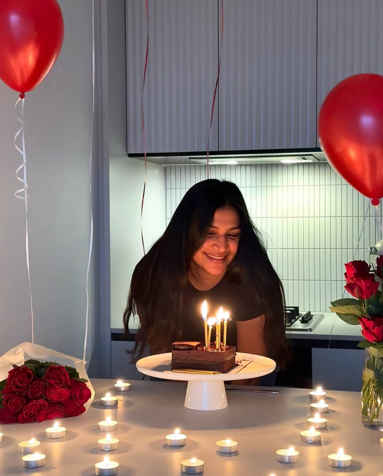Sithumi Fernando, founder of Bakeology Studios, handcrafting a custom cake in her Melbourne studio